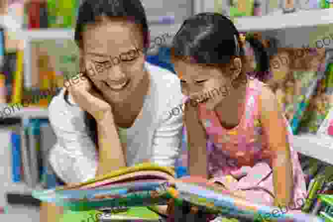 A Young Child And An Adult Reading A Picture Book Together, Smiling And Engaged. Reading Picture With Children: How To Shake Up Storytime And Get Kids Talking About What They See