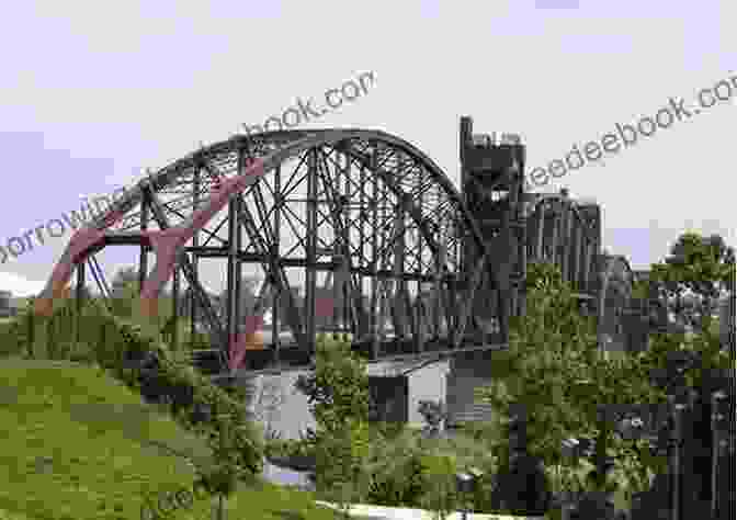 The Arkansas Missouri Railroad Train Crossing A Bridge Over The Arkansas River. Arkansas Missouri Railroad: History Through The Miles